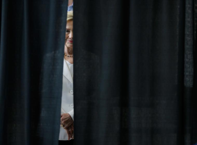Democratic presidential candidate Hillary Rodham Clinton waits to be introduced before speaking about rural issues at the Des Moines Area Community College, Wednesday, Aug. 26, 2015, in Ankeny, Iowa. (AP Photo/Charlie Neibergall)