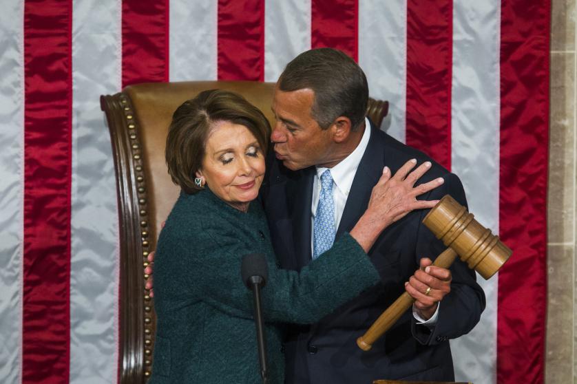 epa04986324 YEARENDER 2015 JANUARY Republican Speaker of the House from Ohio John Boehner (R) kisses Democratic House Minority Leader from California Nancy Pelosi (L) after Boehner was re-elected as Speaker of the House on the floor of the House of Representatives in the US Capitol in Washington, DC, USA, 06 January 2015. EPA/JIM LO SCALZO