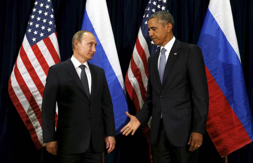 U.S. President Barack Obama extends his hand to Russian President Vladimir Putin during their meeting at the United Nations General Assembly in New York September 28, 2015. REUTERS/Kevin Lamarque - RTX1SYBB